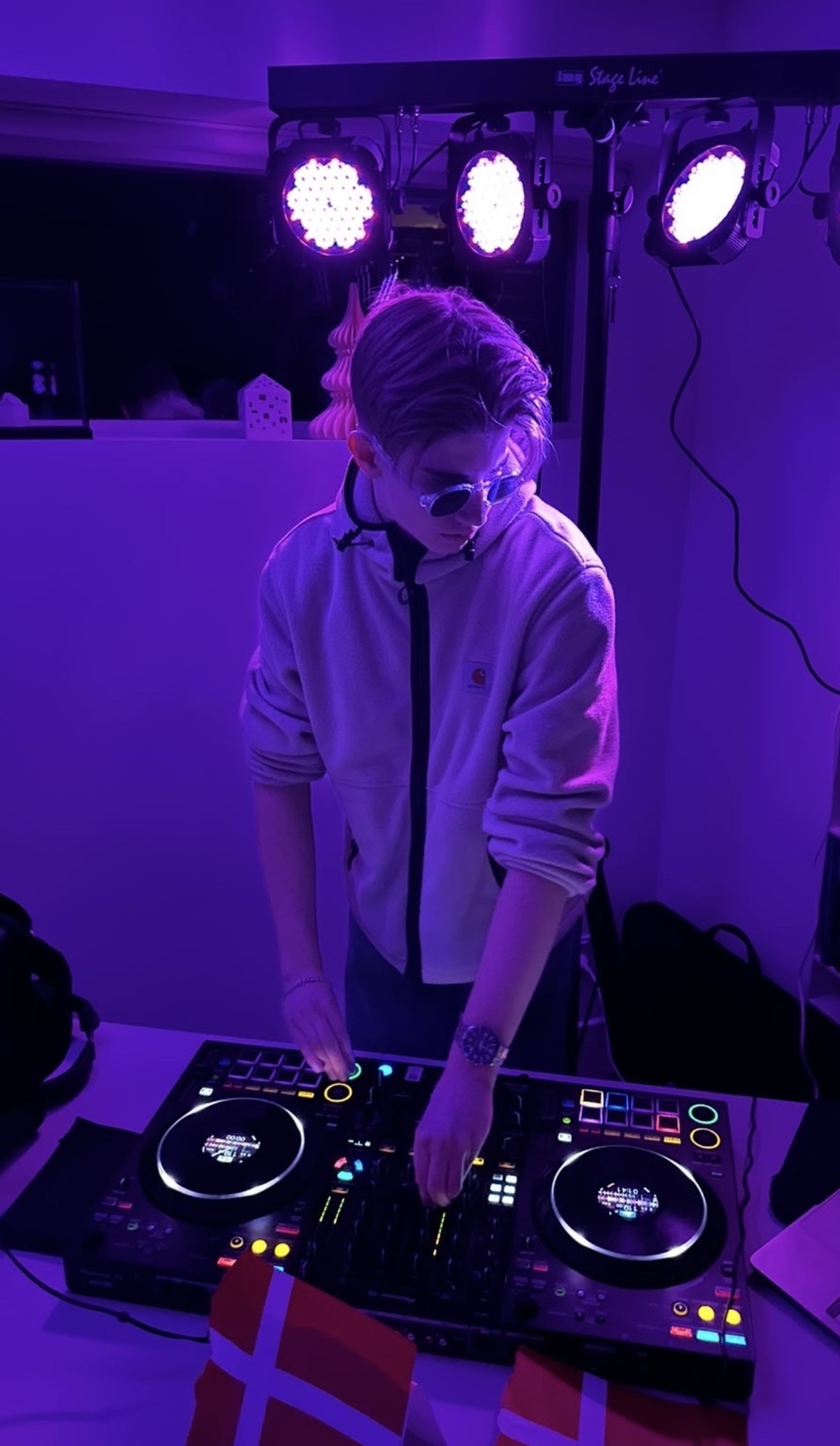 Christian Andersen DJing under purple lights